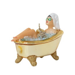 Woman in shiny gold bath